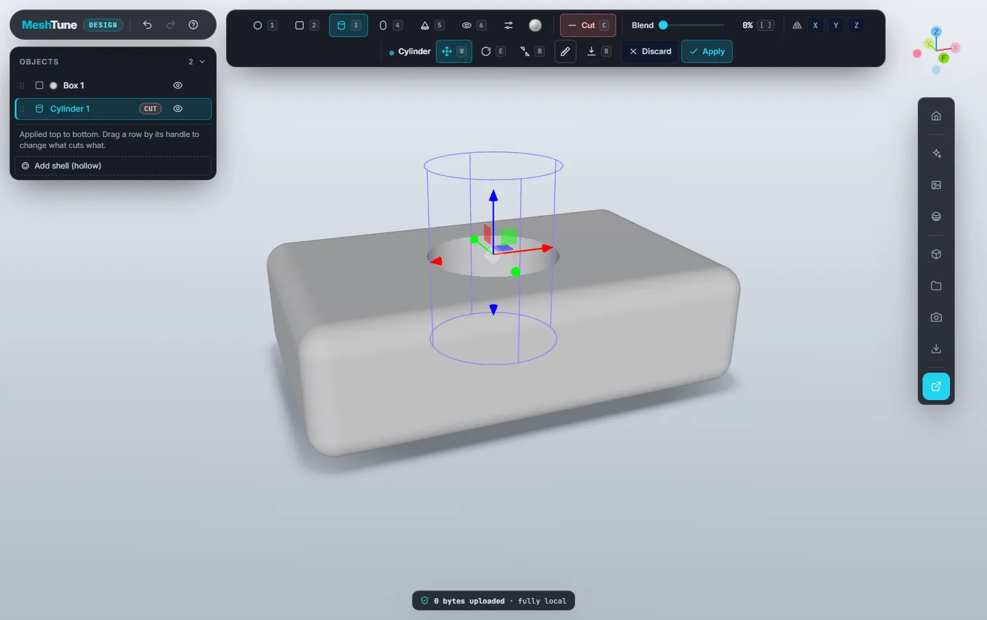 A cylinder being placed in Cut mode through a rounded box, showing its outline and the move handles