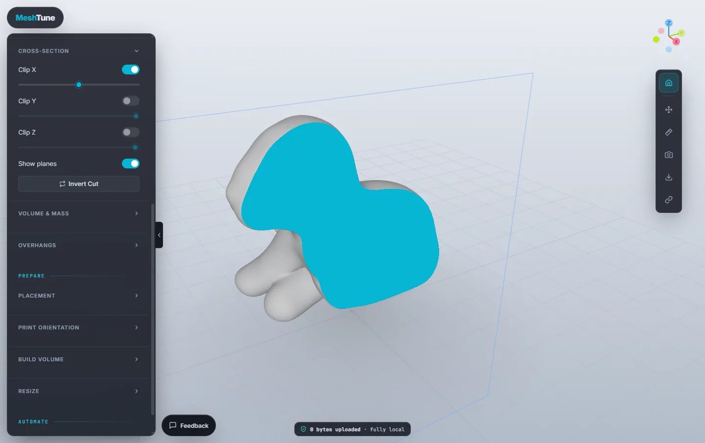 The puppy model clipped along X, showing a solid cyan cut face, with the clipping plane drawn
